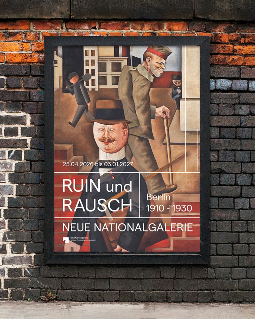 Werbegrafik in Posterrahmen auf Mauer